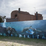 "Responsabilità" Silossanica, smalto e spray su muro 12x3 m Flumini (Q.S.Elena) 2024